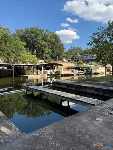 a view of swimming pool with outdoor seating