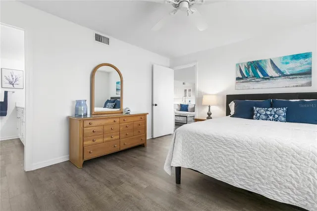 a bedroom with a bed and a dresser