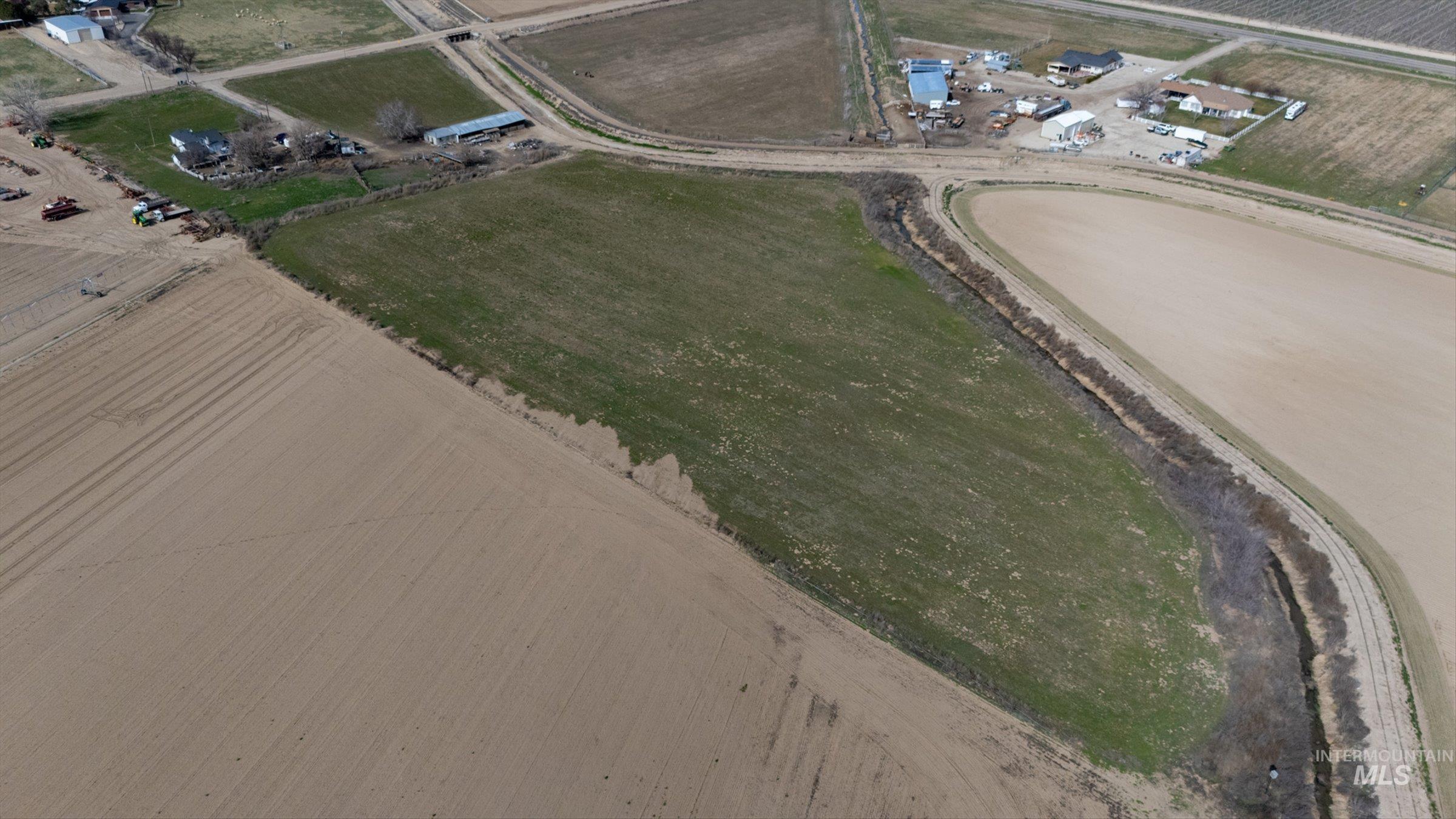 20286 Travis Road Wilder, ID 83676 - Photo 8 of 27 Aerial overview of property's location with rural landscape