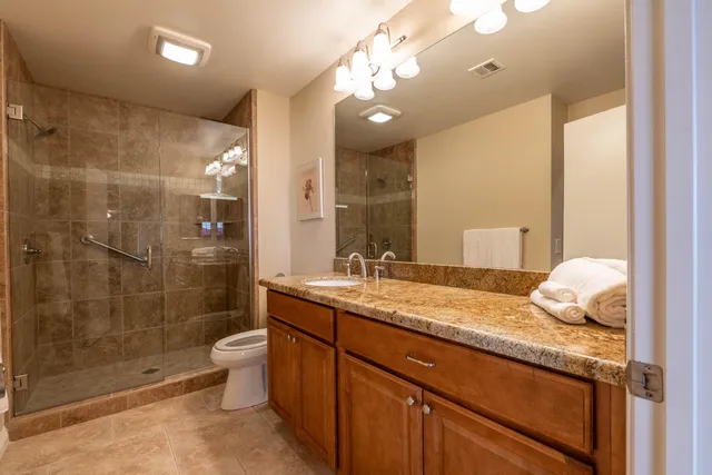 a view of a lake with a table and chairs