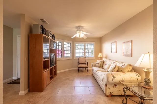 a bed room with a bed and a television