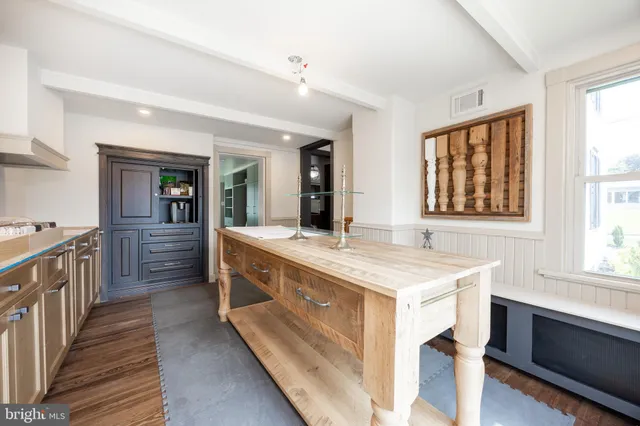 a kitchen with stainless steel appliances granite countertop a stove and a sink
