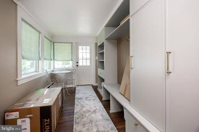 a room with wooden floor and furniture