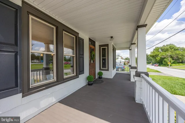 a view of a house with porch and wooden floor