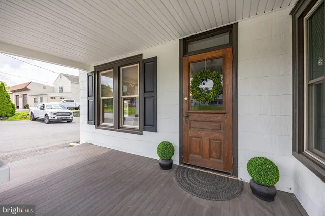 a view of an entryway with wooden floor
