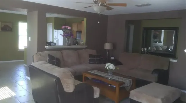 a living room with furniture and a window