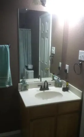 a bathroom with a sink and a mirror