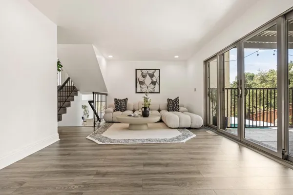 a living room with furniture and a large window