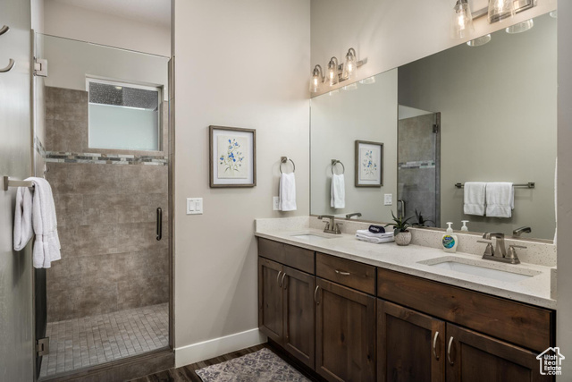 2600 Ocotillo Way, Unit 34 Santa Clara, UT 84765 - Photo 20 of 43 Bathroom with a shower stall and double vanity