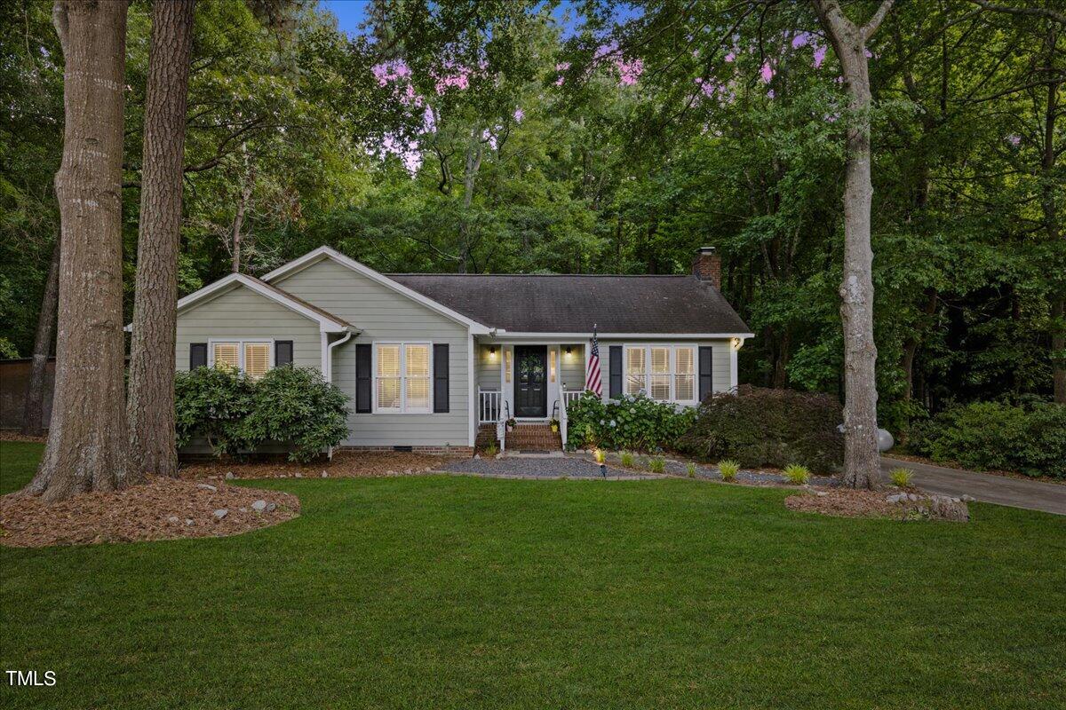 1408 Roy Averette Drive Raleigh, NC 27603 - Photo 1 of 31 a front view of a house with a yard and green space