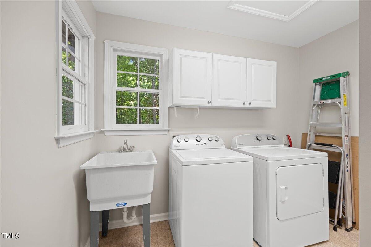 1408 Roy Averette Drive Raleigh, NC 27603 - Photo 15 of 31 a utility room with dryer and washer
