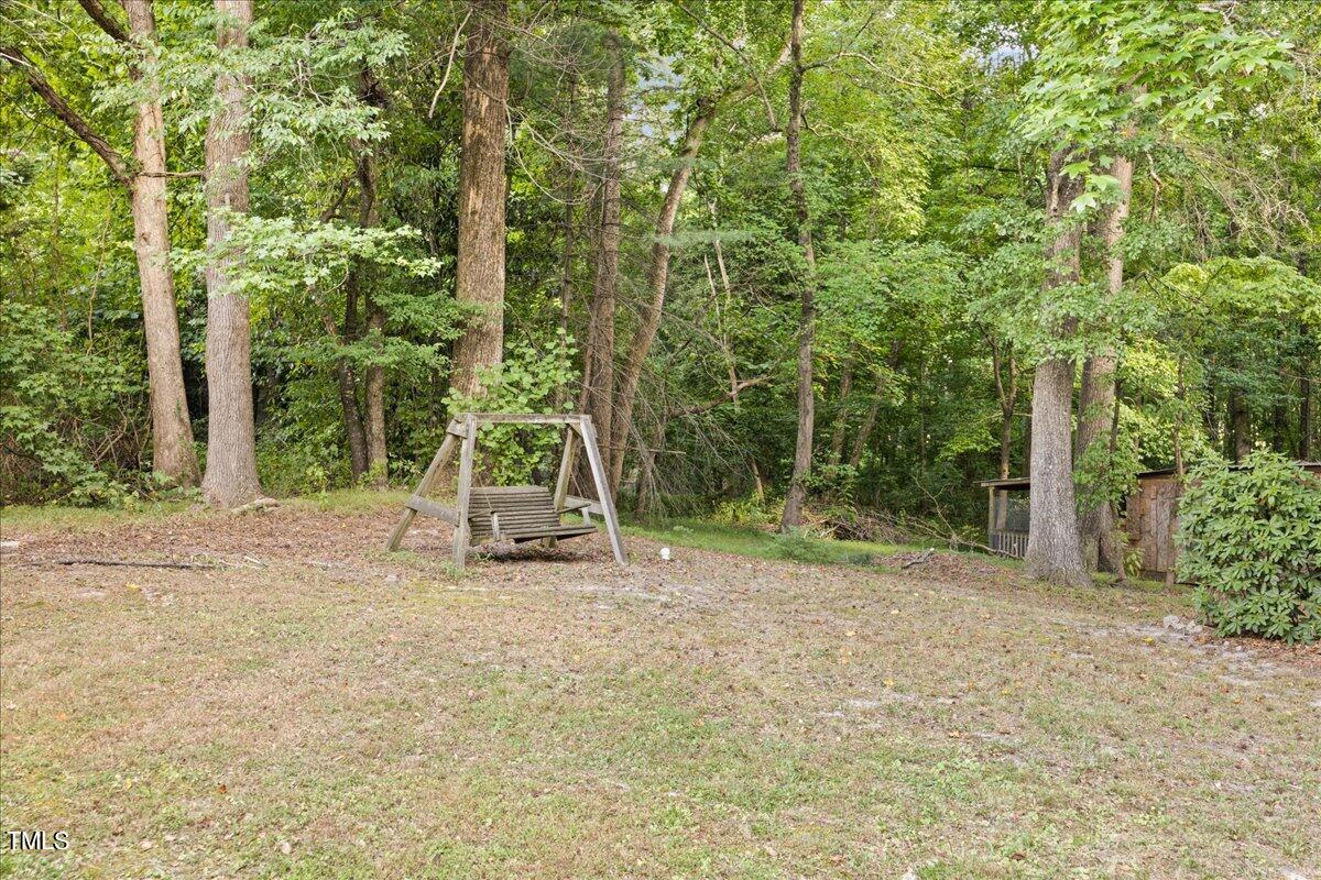 1408 Roy Averette Drive Raleigh, NC 27603 - Photo 23 of 31 a view of a park with a slide