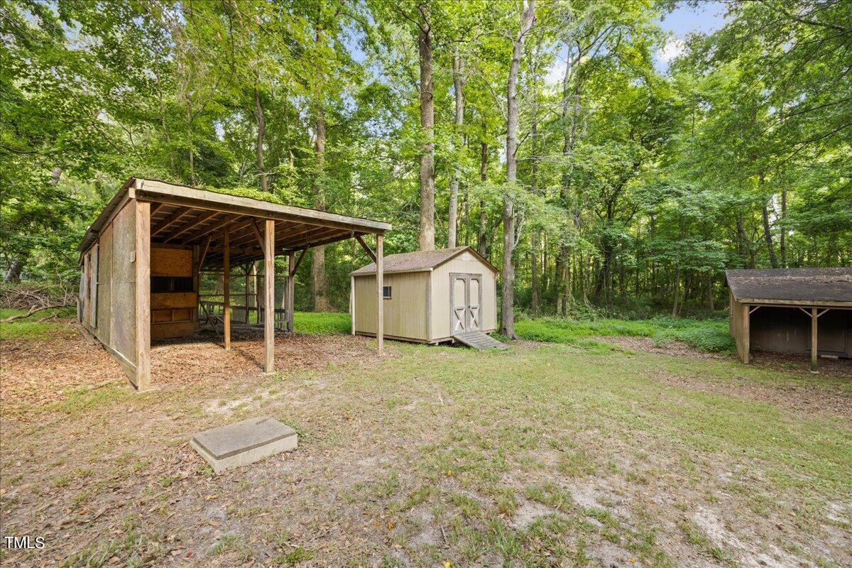 1408 Roy Averette Drive Raleigh, NC 27603 - Photo 24 of 31 a view of a house with backyard and sitting area
