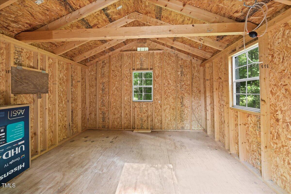 1408 Roy Averette Drive Raleigh, NC 27603 - Photo 28 of 31 a view of a porch with wooden floor and fence next to a window