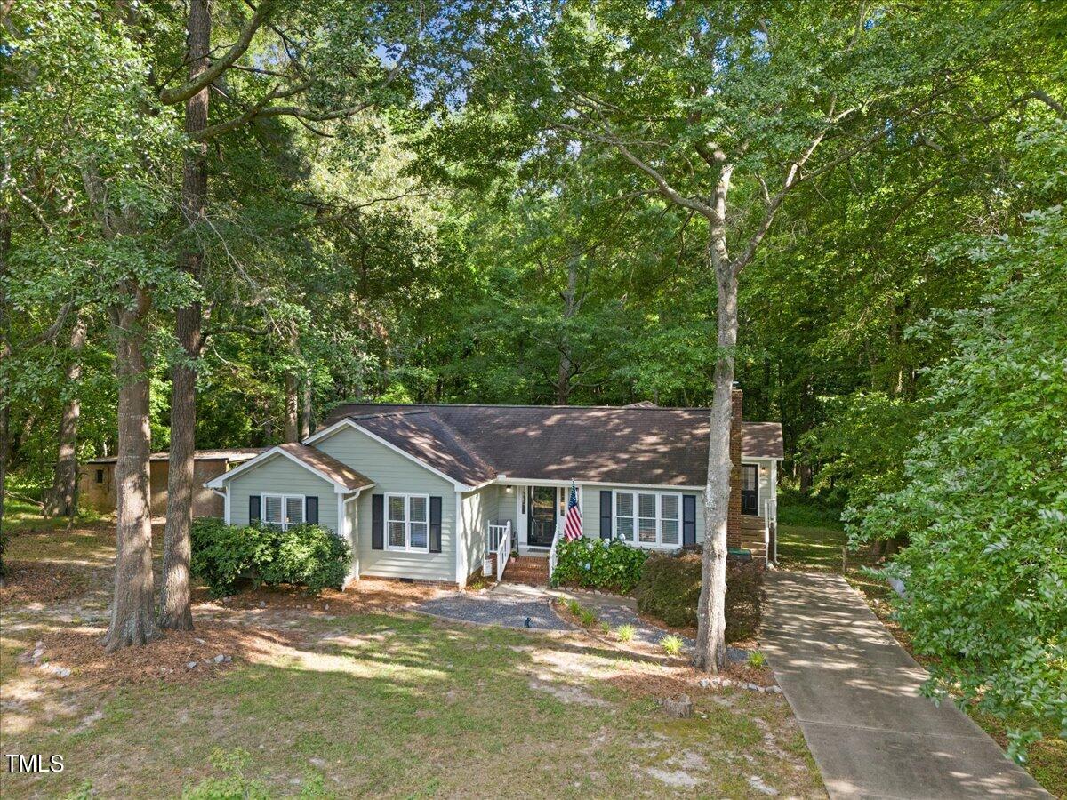 1408 Roy Averette Drive Raleigh, NC 27603 - Photo 3 of 31 a front view of a house with a garden