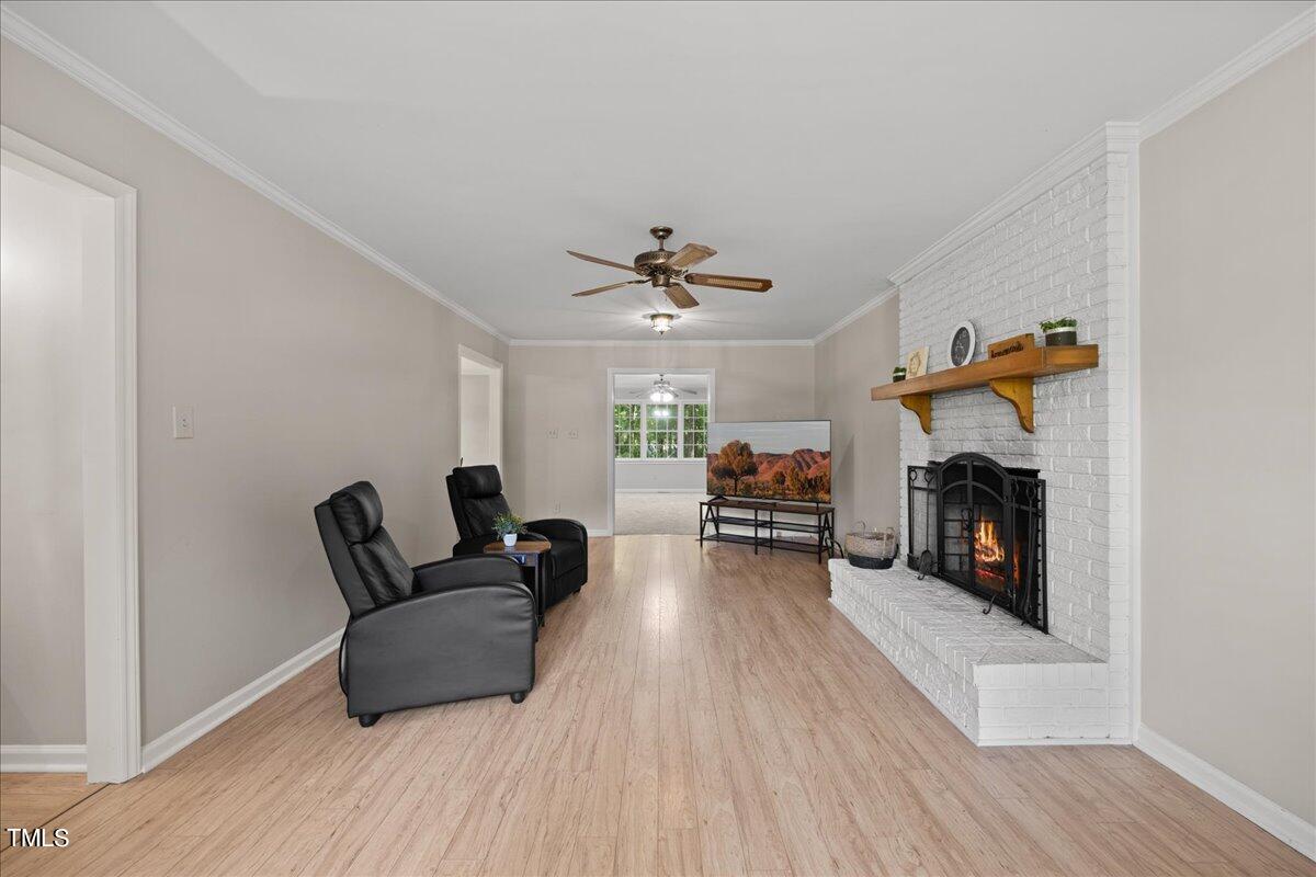 1408 Roy Averette Drive Raleigh, NC 27603 - Photo 5 of 31 a living room with furniture and a fireplace