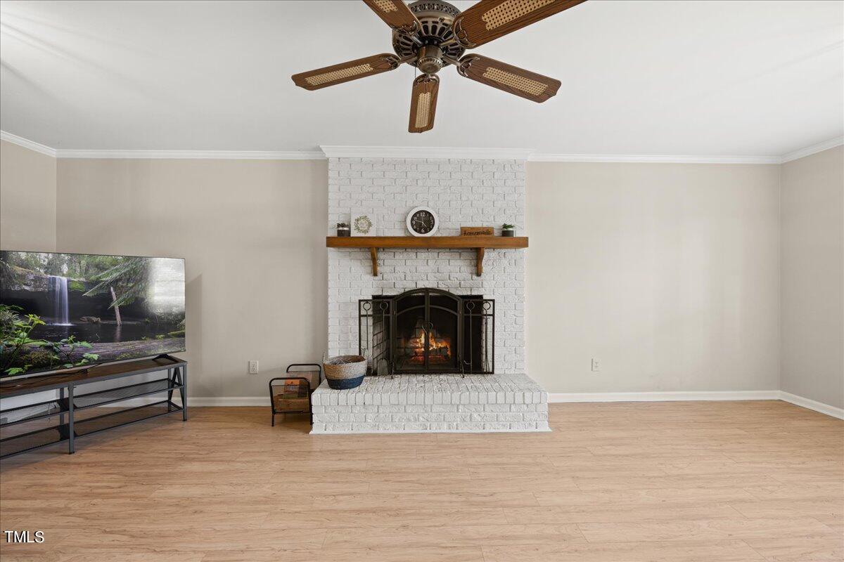 1408 Roy Averette Drive Raleigh, NC 27603 - Photo 6 of 31 a living room with furniture and a fireplace