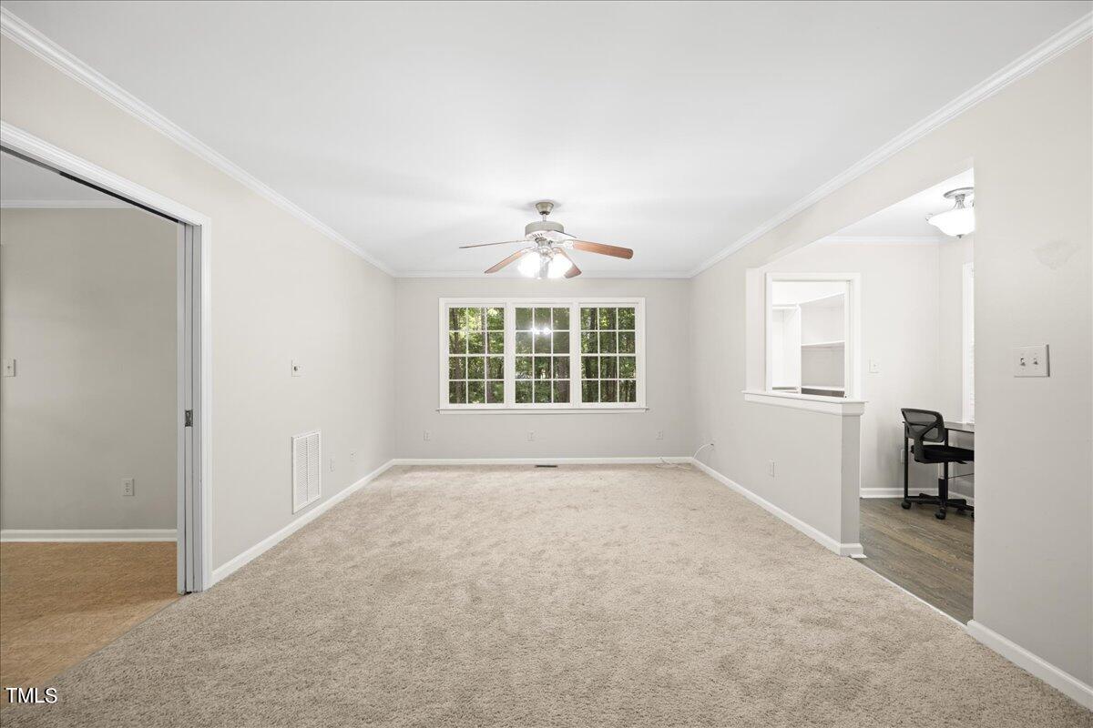 1408 Roy Averette Drive Raleigh, NC 27603 - Photo 8 of 31 a view of an empty room with a window