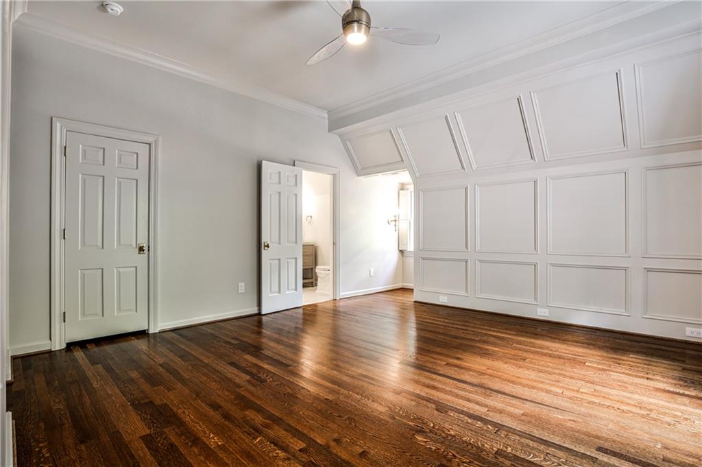 3990 Paces Ferry Road Northwest Atlanta, GA 30327 - Photo 42 of 67 a view of an empty room with wooden floor and a window