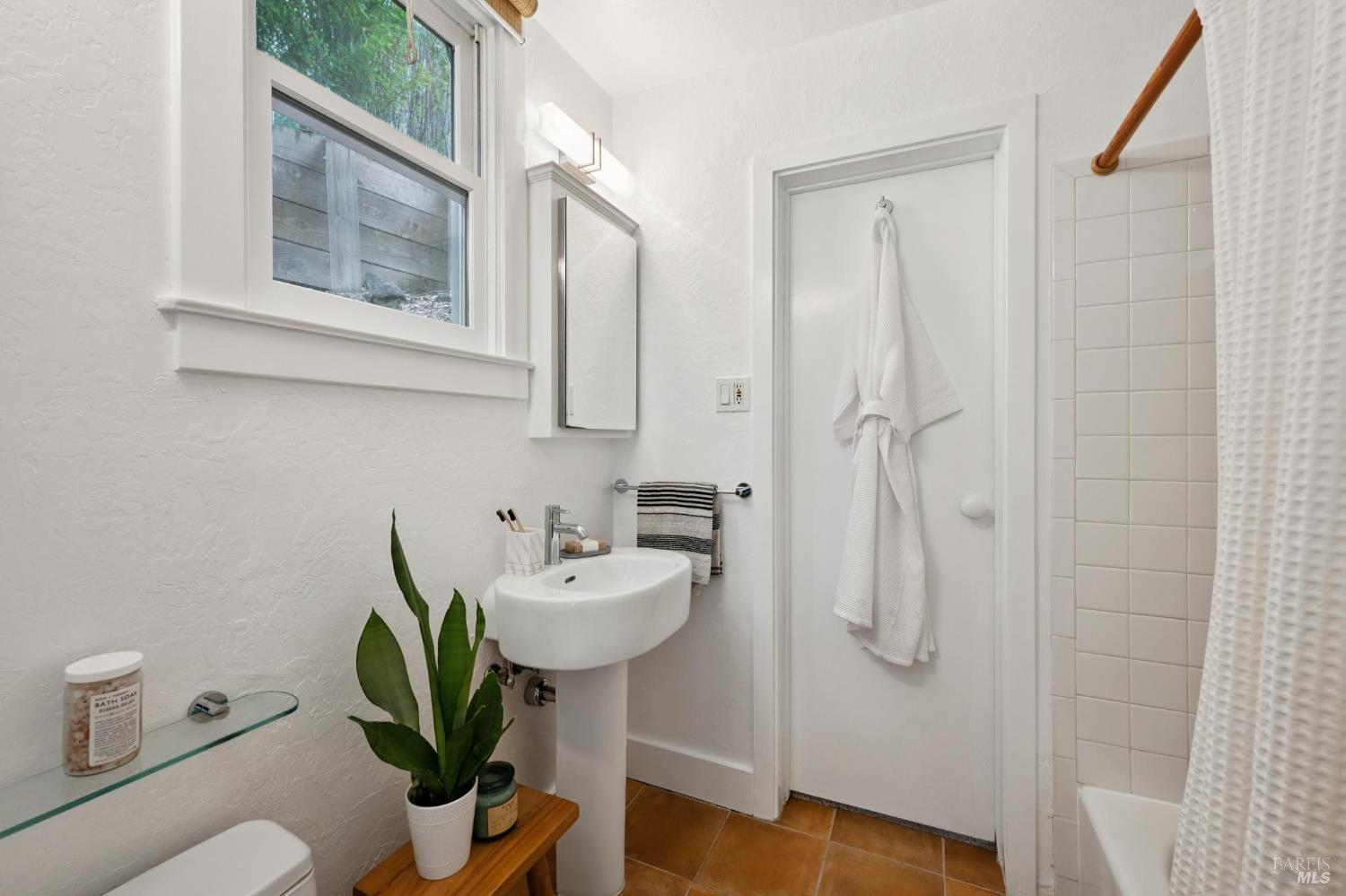 40 Canyon Road San Anselmo, CA 94960 - Photo 11 of 56 The bathroom with a shower over the tub is shared between the two bedrooms.