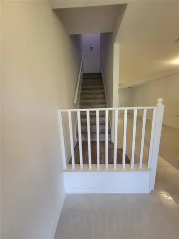 a view of an empty room with stairs