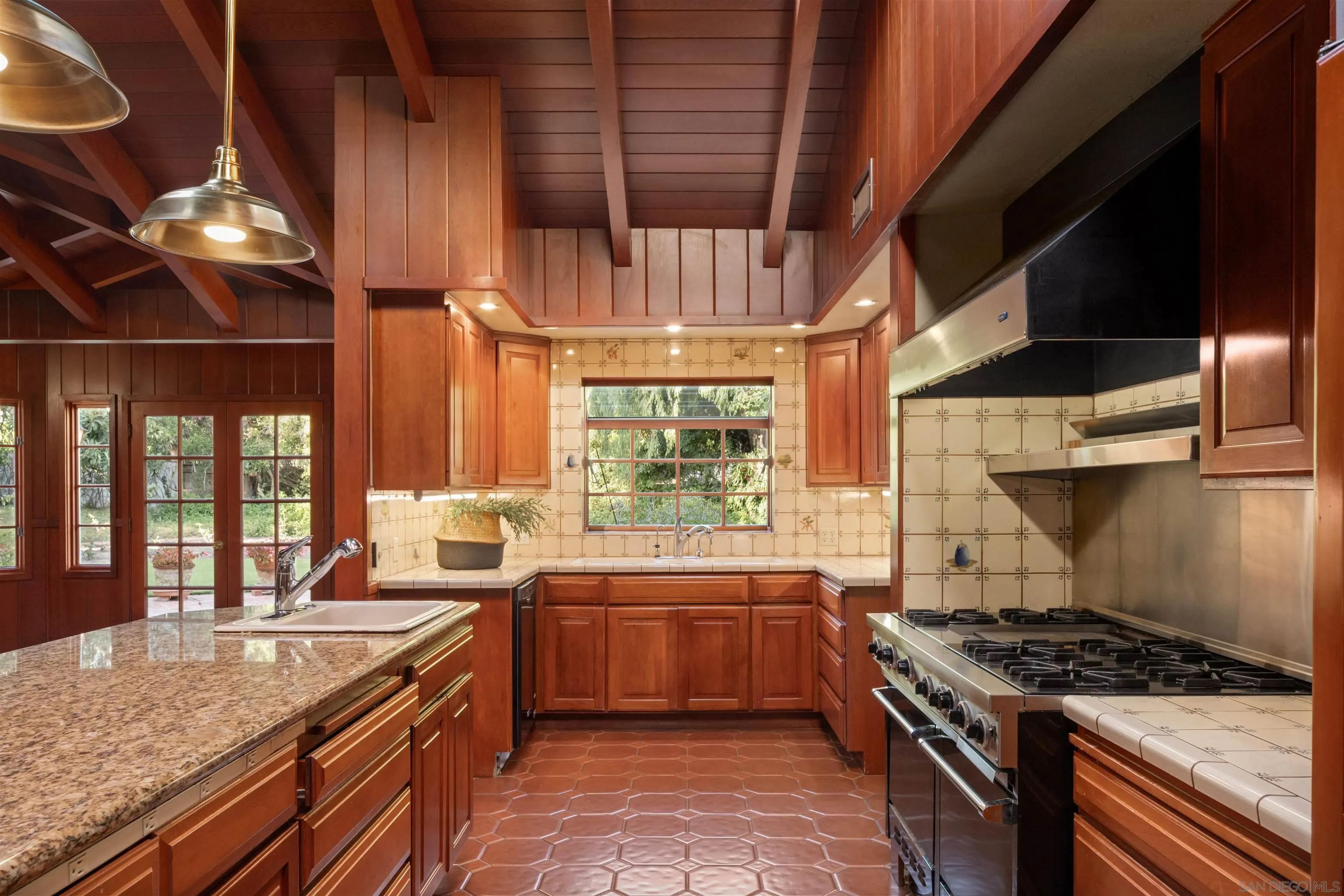 1654 La Jolla Rancho Road La Jolla, CA 92037 - Photo 15 of 31 a kitchen with a stove and a sink