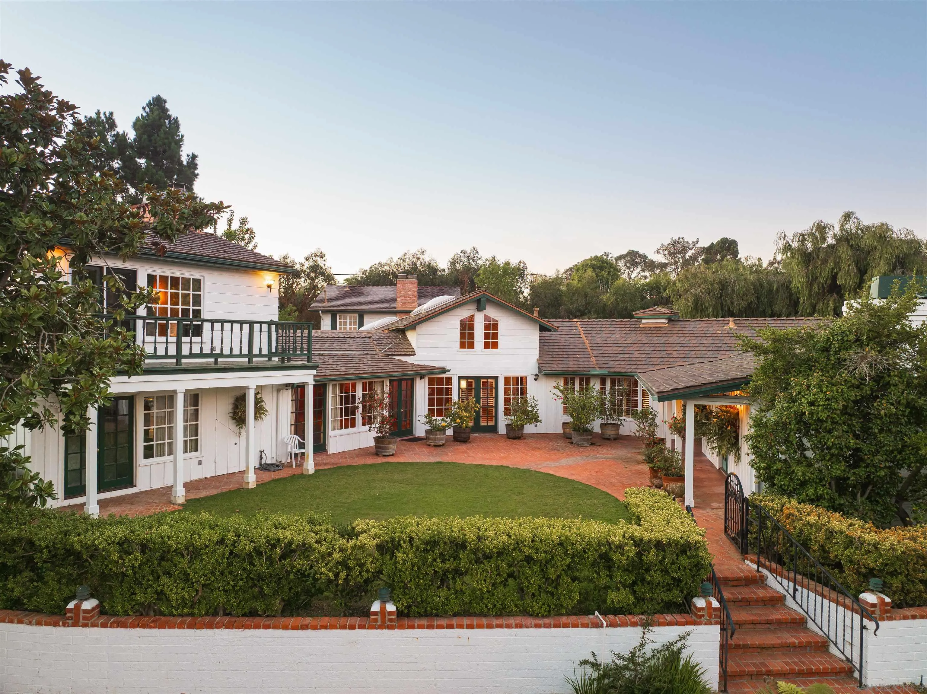 1654 La Jolla Rancho Road La Jolla, CA 92037 - Photo 20 of 31 a front view of a residential houses with yard and green space