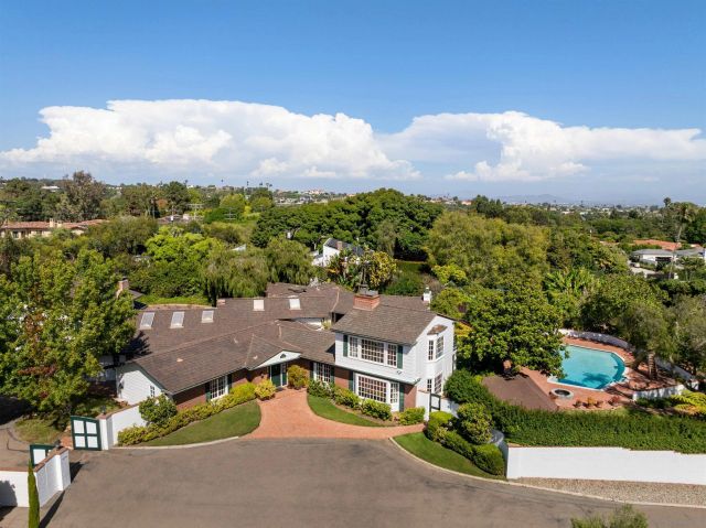 an aerial view of a house with a garden