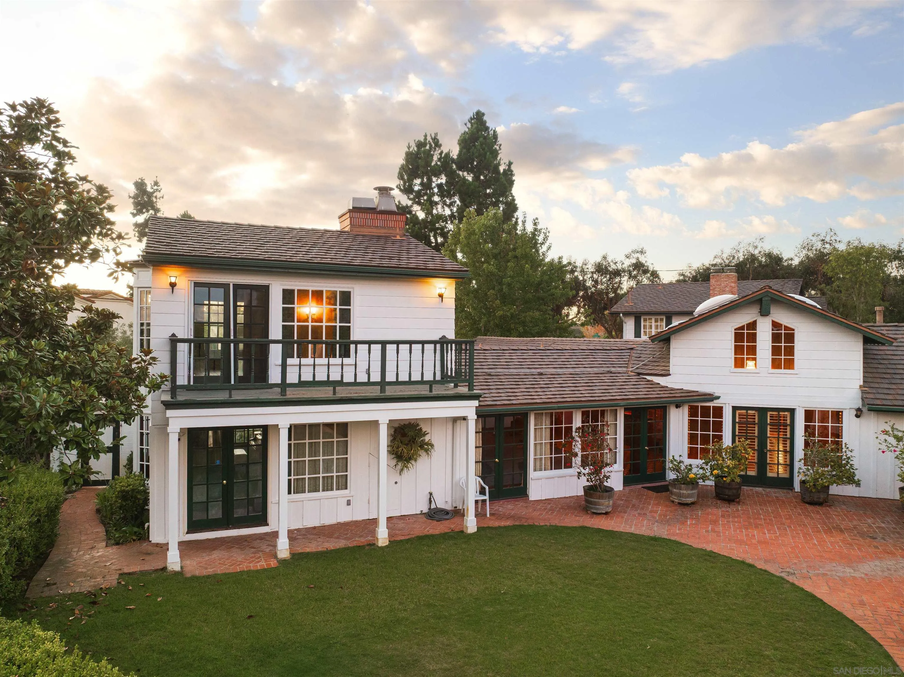 1654 La Jolla Rancho Road La Jolla, CA 92037 - Photo 21 of 31 a front view of a house with a garden