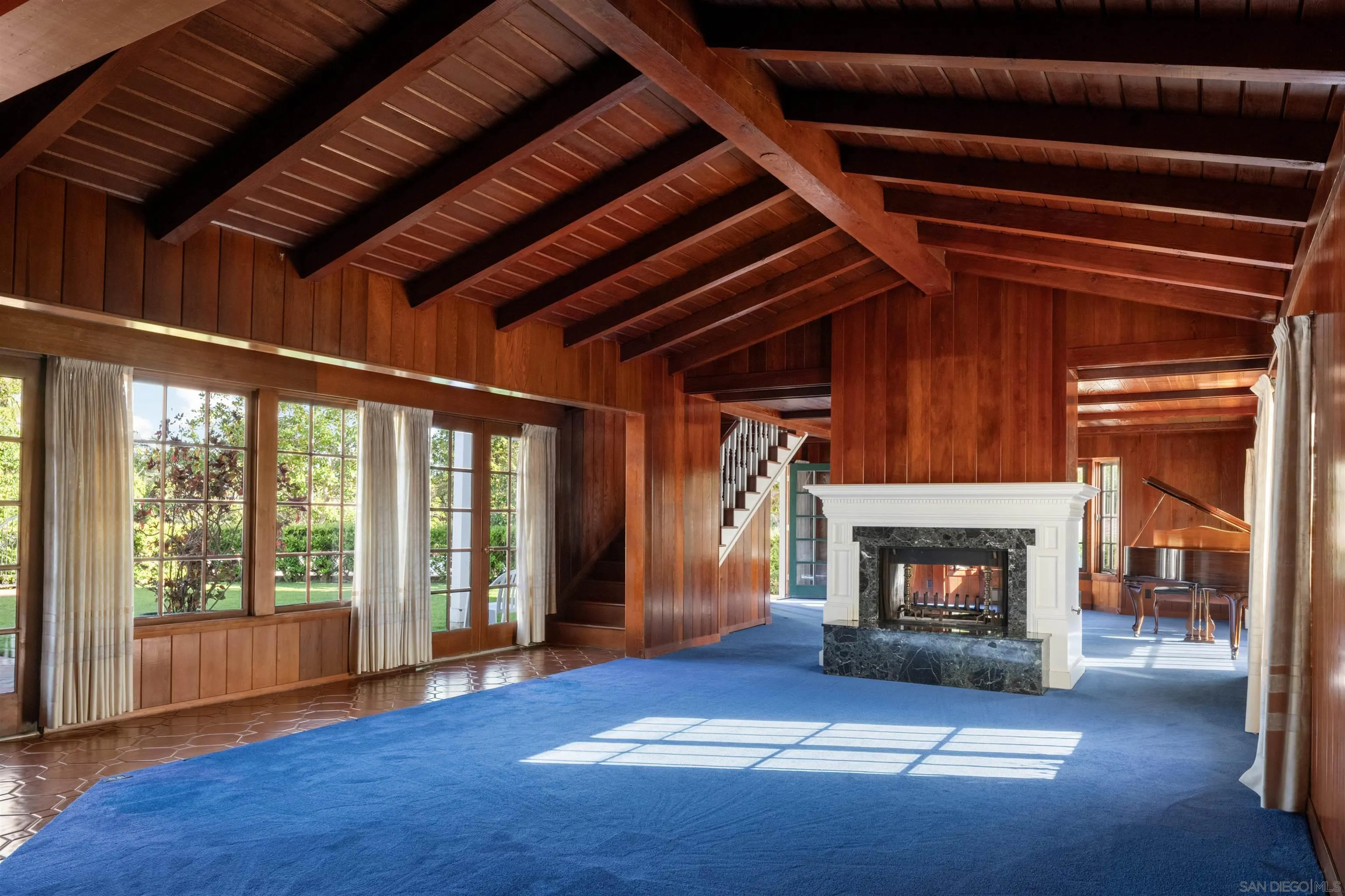 1654 La Jolla Rancho Road La Jolla, CA 92037 - Photo 7 of 31 a living room with furniture and a fireplace