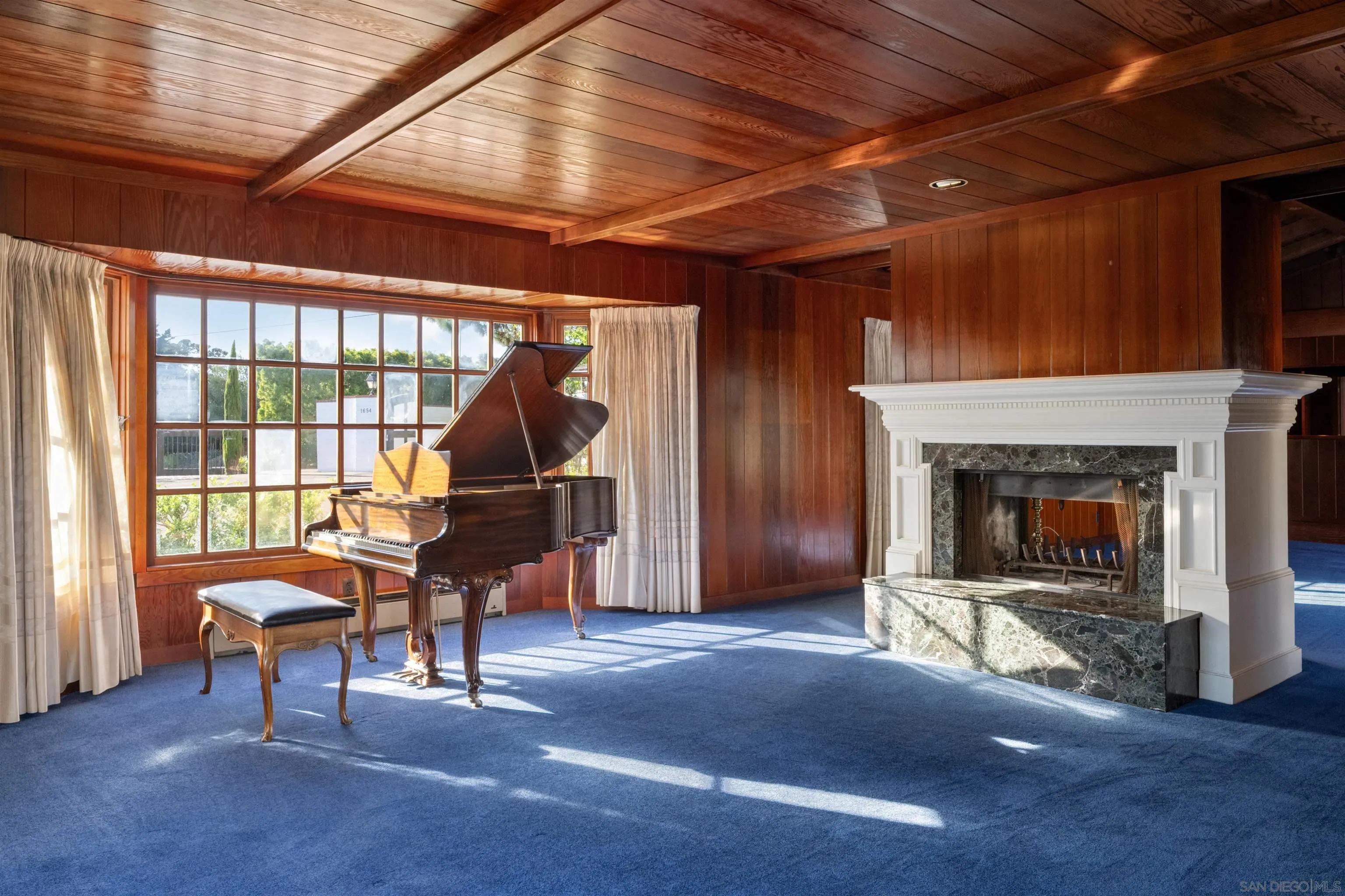 1654 La Jolla Rancho Road La Jolla, CA 92037 - Photo 9 of 31 a living room with furniture and a fireplace
