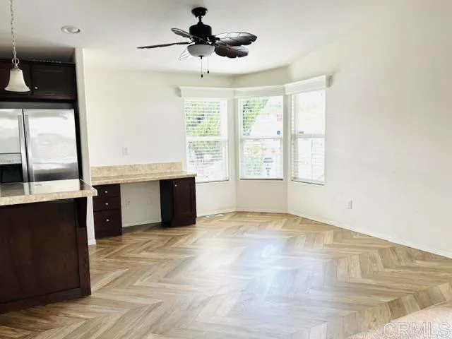 a view of a kitchen with a sink and a window