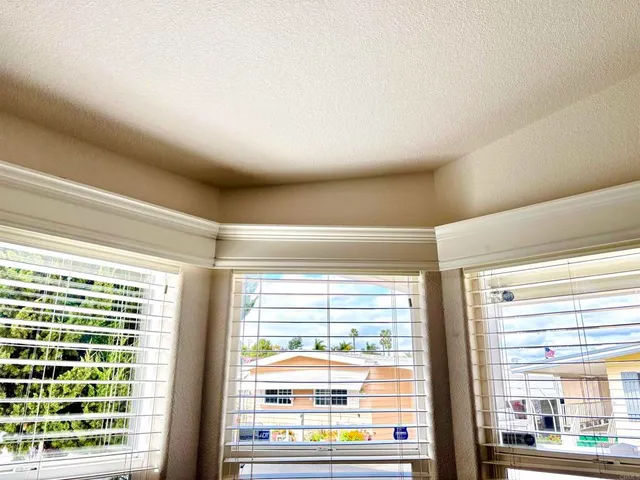 a view of a room with a large window