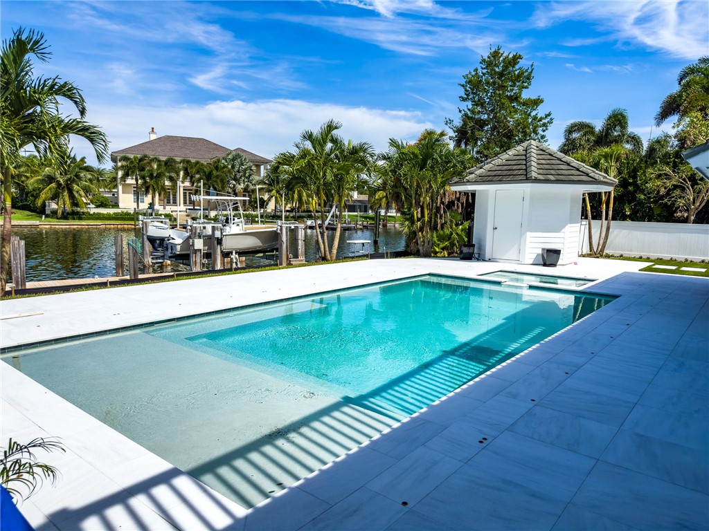 245 Springline Drive Vero Beach, FL 32963 - Photo 1 of 35 a view of a swimming pool with an outdoor seating