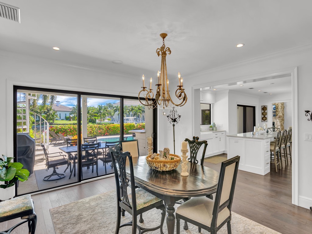 245 Springline Drive Vero Beach, FL 32963 - Photo 11 of 35 a view of a dining room with furniture window and wooden floor