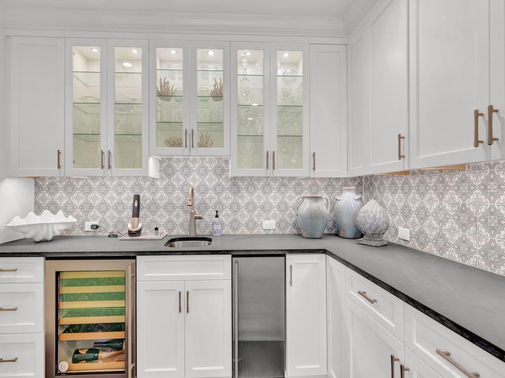 245 Springline Drive Vero Beach, FL 32963 - Photo 13 of 35 a kitchen with stainless steel appliances granite countertop a sink and a white cabinets