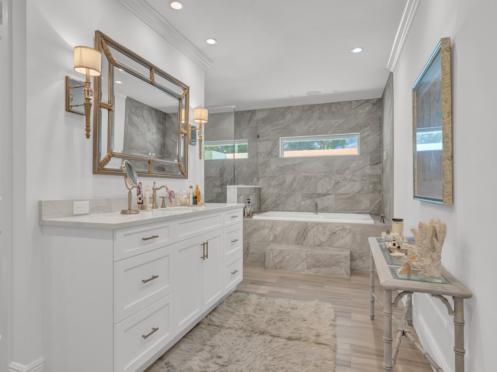 245 Springline Drive Vero Beach, FL 32963 - Photo 16 of 35 a bathroom with double vanity sink and a mirror