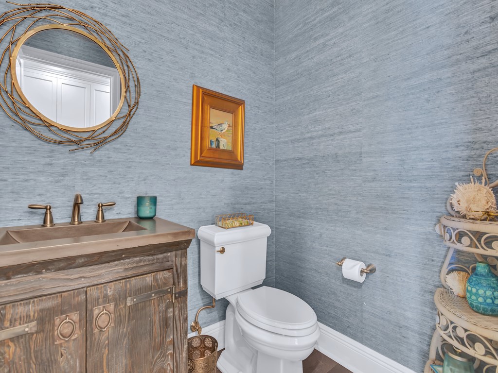 245 Springline Drive Vero Beach, FL 32963 - Photo 19 of 35 a bathroom with a toilet a sink and mirror