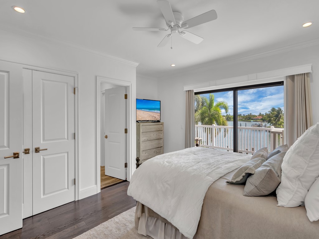 245 Springline Drive Vero Beach, FL 32963 - Photo 21 of 35 a bedroom with a large bed and a window