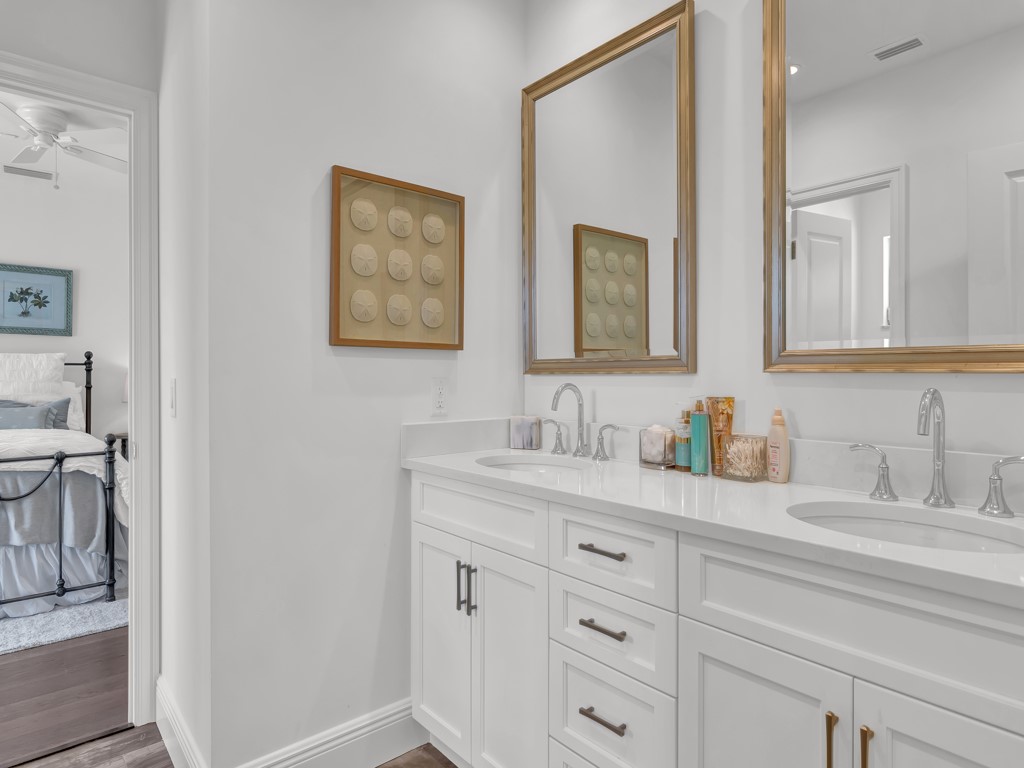 245 Springline Drive Vero Beach, FL 32963 - Photo 22 of 35 a bathroom with double sink and a mirror