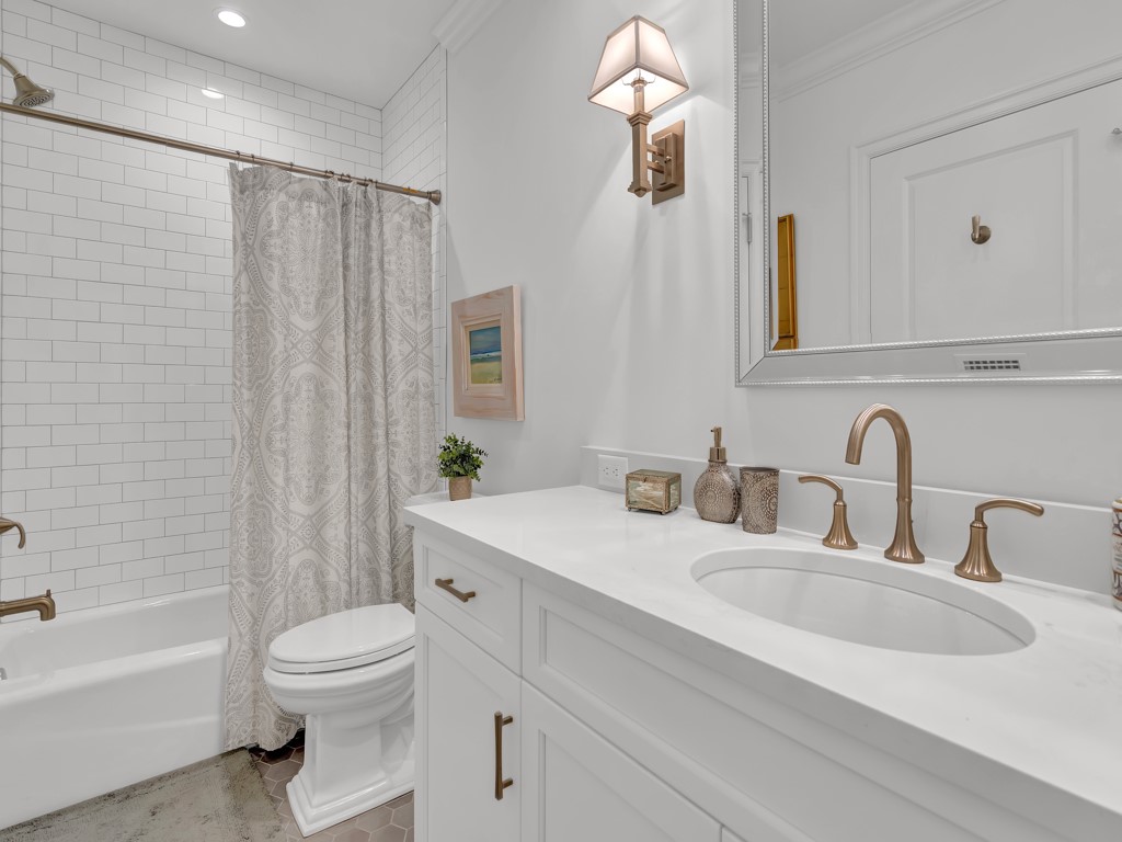 245 Springline Drive Vero Beach, FL 32963 - Photo 23 of 35 a bathroom with a double vanity sink toilet and shower