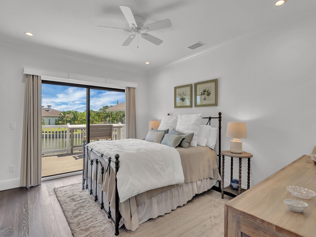 245 Springline Drive Vero Beach, FL 32963 - Photo 24 of 35 a bed sitting in a bedroom next to a window