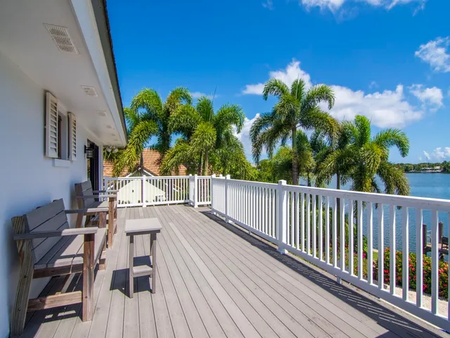 a view of a balcony with chairs