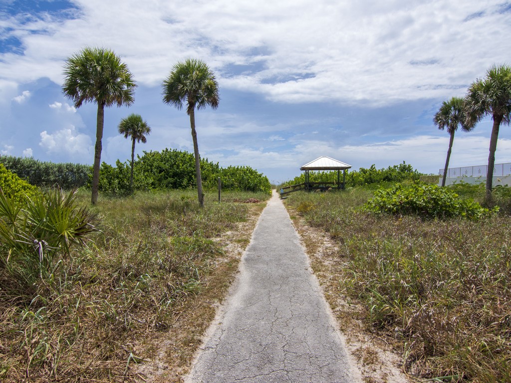 245 Springline Drive Vero Beach, FL 32963 - Photo 33 of 35 a front view of a house with a yard and potted plants