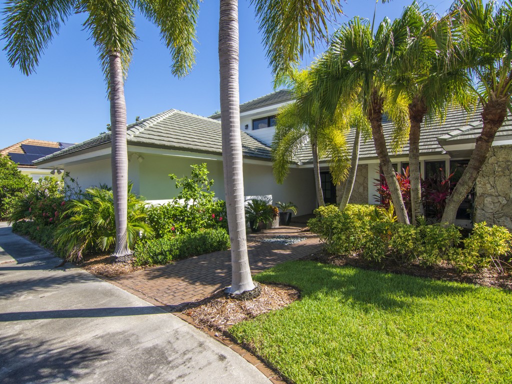 245 Springline Drive Vero Beach, FL 32963 - Photo 35 of 35 a view of a house with a yard and palm trees