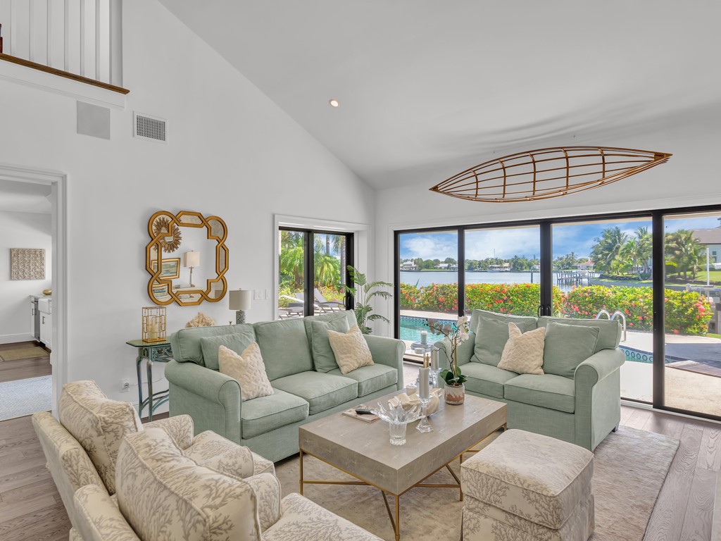 245 Springline Drive Vero Beach, FL 32963 - Photo 6 of 35 a living room with furniture and a large window