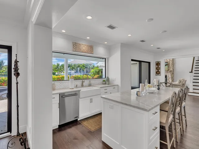 a kitchen with stainless steel appliances granite countertop stove top oven and sink