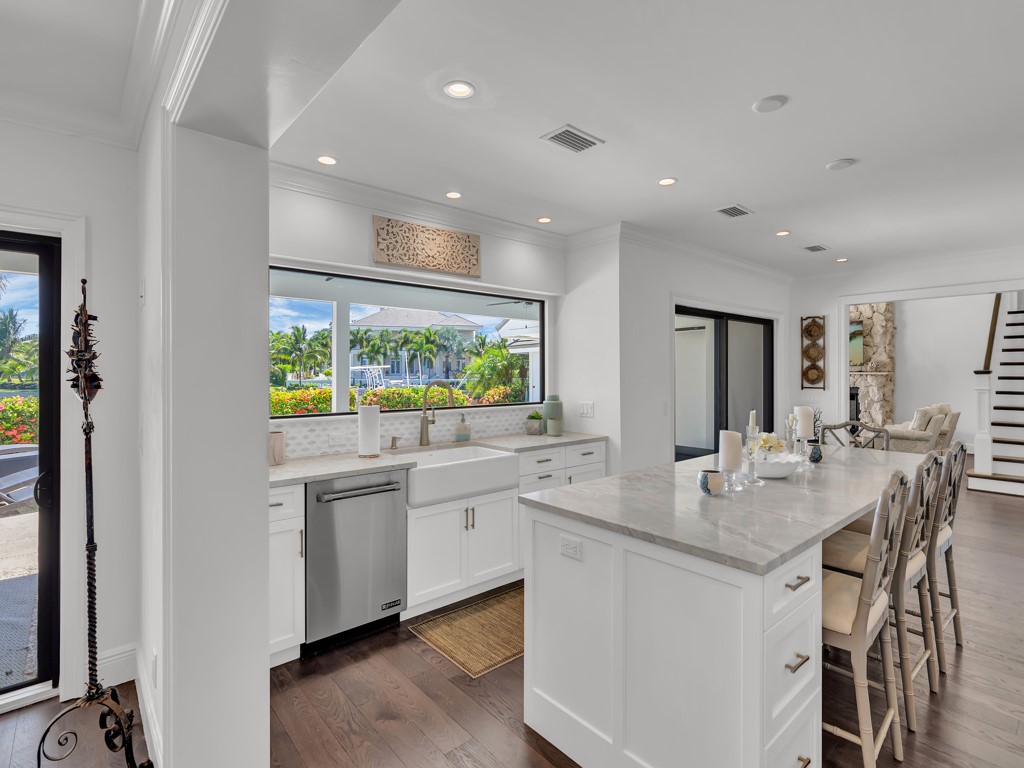 245 Springline Drive Vero Beach, FL 32963 - Photo 9 of 35 a kitchen with stainless steel appliances granite countertop stove top oven and sink