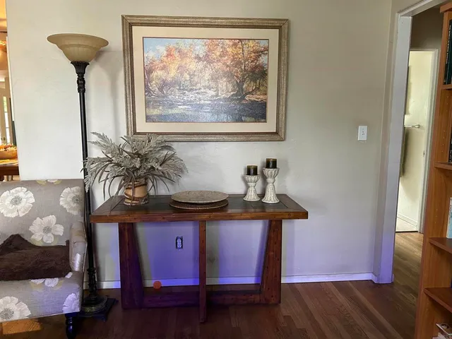 a view of a livingroom with furniture and wooden floor