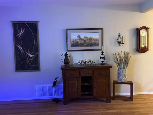 a room with a dresser and a window